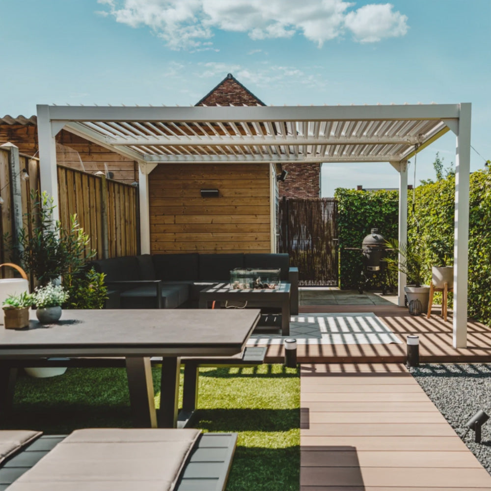 Modern white metal pergola in a stylish garden seating and dining area